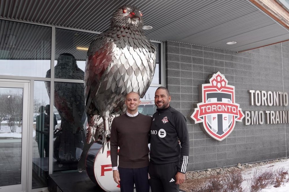 Toronto FC GM Jason Hernandez, left, and newly named head coach Robin Fraser pose in front of a statue of a giant hawk, the club mascot, outside the MLS club’s training centre, in Toronto, Wednesday, Jan. 15, 2025. The statue will eventually land at BMO Field, possibly with the slogan “Hunt for Glory.” THE CANADIAN PRESS/Neil Davidson