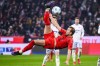 Munich's Harry Kane in action with a bicycle kick during a German Bundesliga soccer match between FC Bayern Munich and TSG 1899 Hoffenheim in Munich, Germany, Wednesday, Jan. 15, 2025.(Tom Weller/dpa via AP)