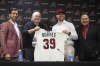Arizona Diamondbacks introduce new starting pitcher Corbin Burnes, second from right, as he poses with Diamondbacks owner Ken Kendrick, second from left, Diamondbacks Executive Vice President and General Manager, left, and Burnes's agent Scott Boras, right, during a news conference, Wednesday, Jan. 15, 2025, in Phoenix. (AP Photo/Ross D. Franklin)