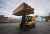 A worker uses a forklift to move lumber at a mill in Maple Ridge, B.C., Tuesday, April 25, 2017. THE CANADIAN PRESS/Darryl Dyck