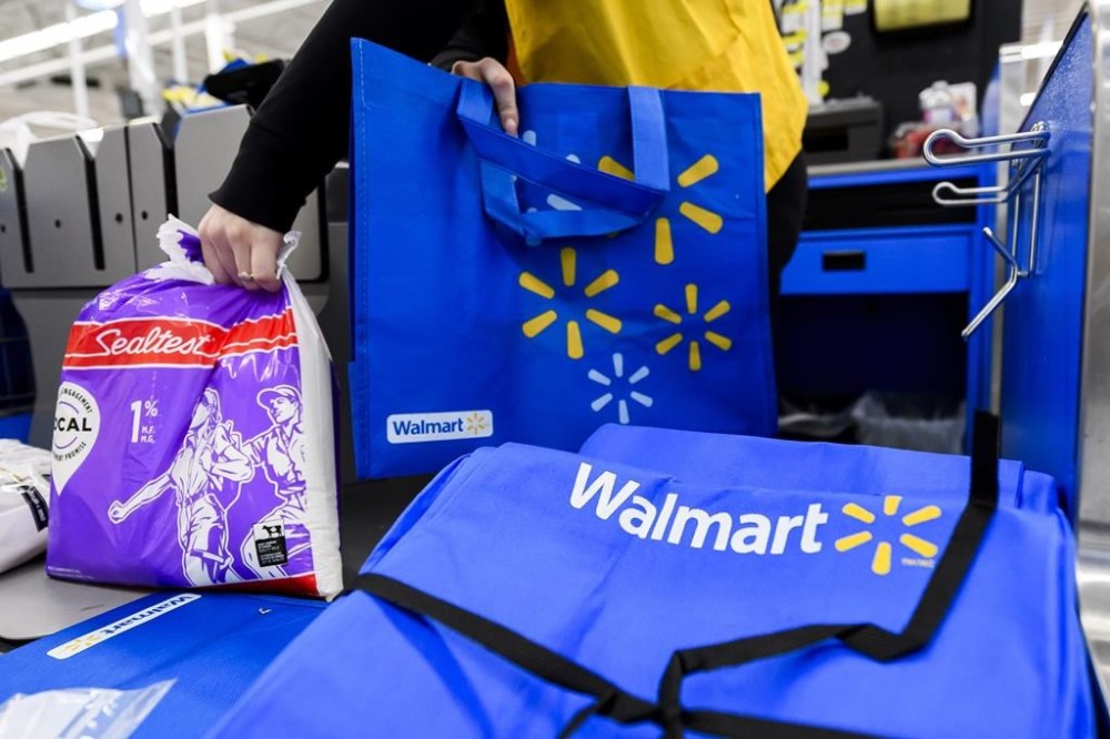 Employees are seen working at a Walmart in Vaughan, Ont., Wednesday, July 2, 2024. THE CANADIAN PRESS/Christopher Katsarov