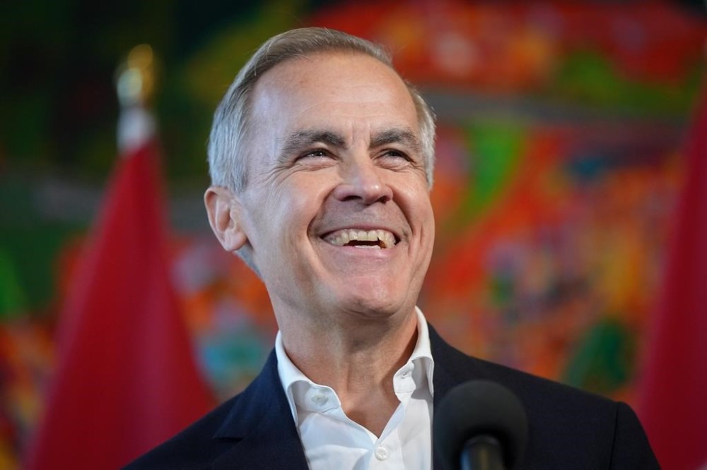 Former Bank of Canada governor Mark Carney laughs while speaking to reporters at the Liberal caucus retreat in Nanaimo, B.C., on Tuesday, September 10, 2024. THE CANADIAN PRESS/Darryl Dyck