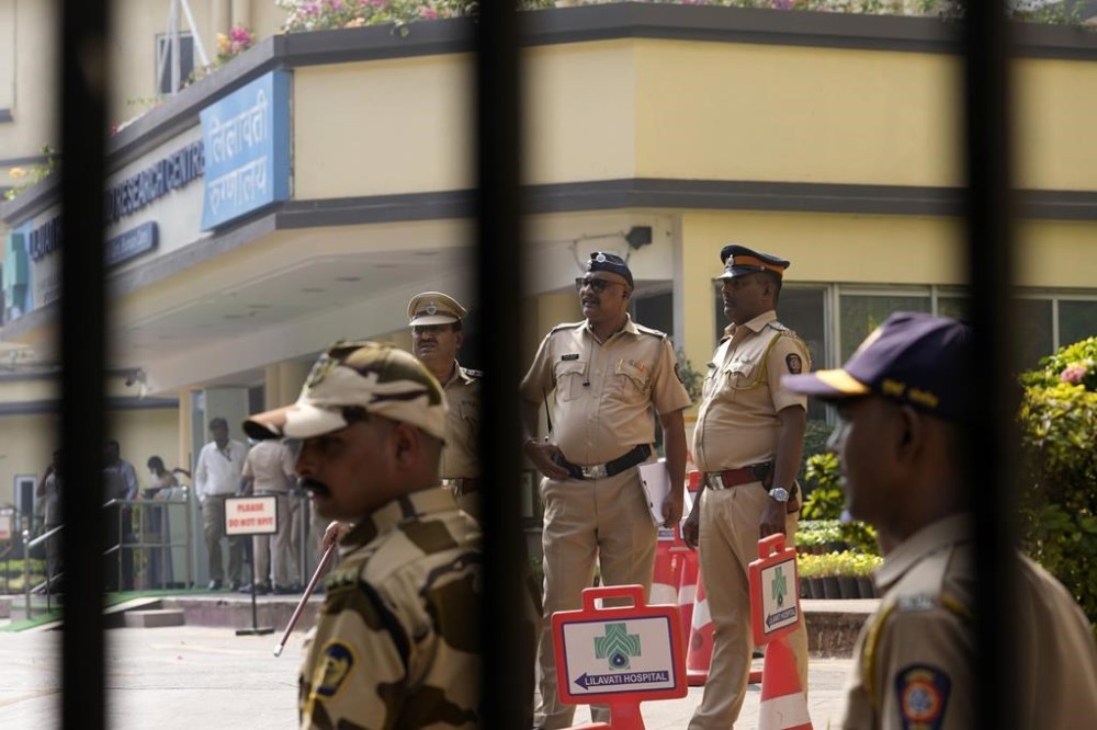 Police personnel stand outside Lilavati hospital where Bollywood actor Saif Ali Khan underwent surgery for stab injuries after a scuffle with an intruder at his home in Mumbai, Thursday, Jan. 16, 2025.(AP Photo/Rajanish Kakade)