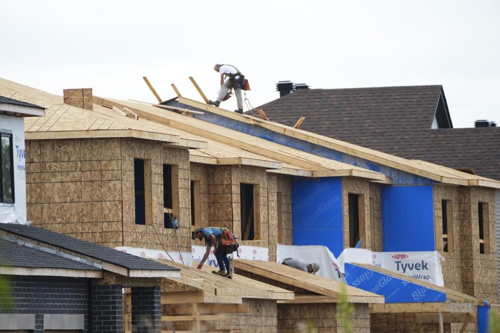 Canada Mortgage and Housing Corp. says the total number of housing starts in 2024 rose two per cent compared with 2023, helped by increased starts in Alberta, Quebec and the Atlantic provinces. New homes are constructed in Ottawa on Monday, Aug. 14, 2023. THE CANADIAN PRESS/Sean Kilpatrick