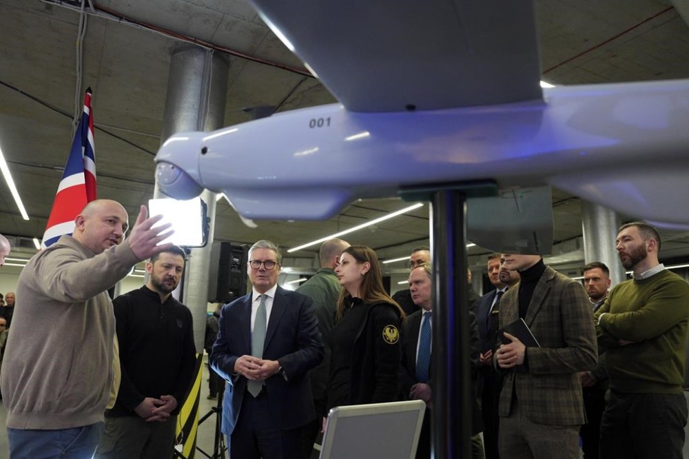 British Prime Minister Keir Starmer, 3rd left, and Ukrainian President Volodymyr Zelenskyy, 2nd left, attend a presentation of Ukrainian military drones at an undisclosed location in Kyiv, Ukraine, Thursday, Jan. 16, 2025. (Carl Court, Pool Photo via AP)