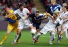 Britain's Casey Stoney, center, is stopped by Canada's Melissa Tancredi, second from left, and Kelly Parker, during their quarterfinal women's soccer match at the 2012 London Summer Olympics, in Coventry, England on August 3, 2012. THE CANADIAN PRESS/AP, Armando Franca