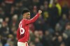 Manchester United's Amad Diallo celebrates after scoring his side's third goal during the English Premier League soccer match between Manchester United and Southampton at the Old Trafford stadium in Manchester, England, Thursday, Jan. 16, 2025. (AP Photo/Dave Thompson)