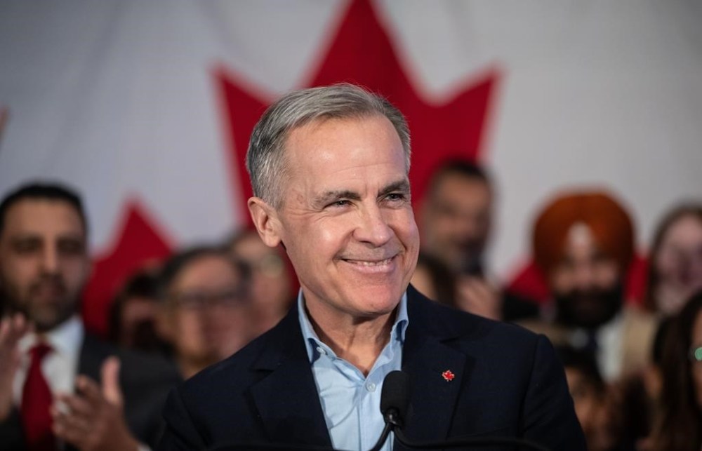 Mark Carney smiles during his Liberal leadership campaign launch in Edmonton, on Thursday January 16, 2025.THE CANADIAN PRESS/Jason Franson