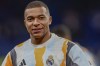 Real Madrid's Kylian Mbappe warms up prior to a Copa del Rey round of 16 soccer match against Celta de Vigo at the Santiago Bernabeu stadium in Madrid, Spain, Thursday, Jan. 16, 2025. (AP Photo/Pablo Garcia)