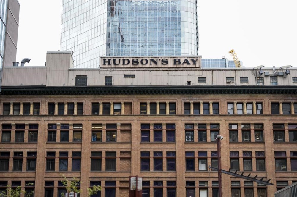 Hudson's Bay says it has laid off 41 staff as it revamps the retailer's structure. Hudson’s Bay signage is pictured in the financial district in Toronto, Friday, Sept. 8, 2023. THE CANADIAN PRESS/Andrew Lahodynskyj