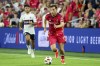 FILE - St. Louis City's Indiana Vassilev dribbles ahead of Vancouver Whitecaps' Ryan Raposo during the second half of an MLS soccer match Saturday, July 13, 2024, in St. Louis. (AP Photo/Scott Kane, File)