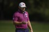 Tyrell Hatton of England juggles the ball as he walks towards 9th fairway during the third round of the Dubai Desert Classic golf tournament, in Dubai, United Arab Emirates, Saturday, Jan. 18, 2025. (AP Photo/Altaf Qadri)