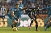 Bournemouth's Illya Zabarnyi, left, and Newcastle United's Alexander Isak, right, challenge for the ball during the English Premier League soccer match between Newcastle United and AFC Bournemouth in Newcastle upon Tyne, England, Saturday, Jan. 18, 2025. (Owen Humphreys/PA via AP)