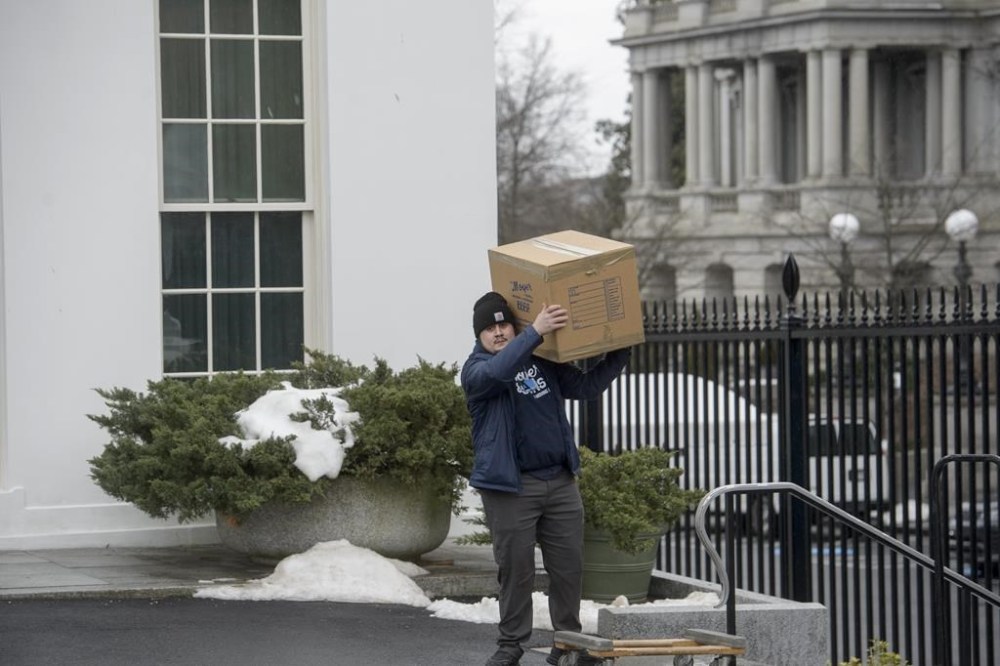 Movers load trucks at the White House grounds two days before Inauguration Day and a new administration, in Washington, Saturday, Jan. 18, 2025. (AP Photo/Rod Lamkey, Jr.)