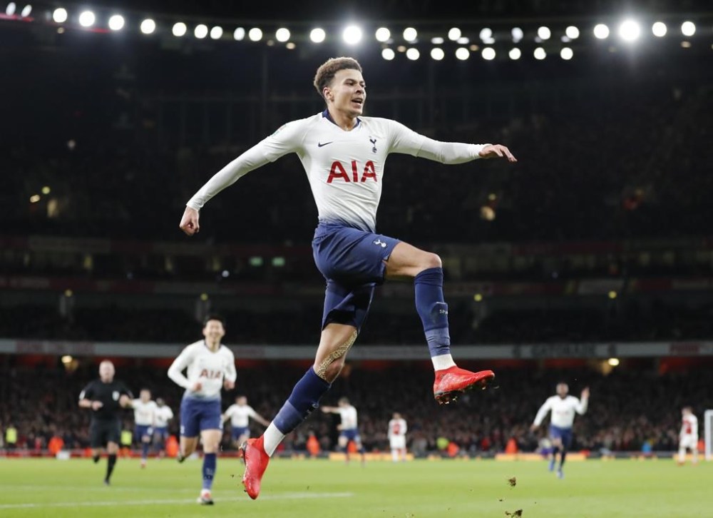 FILE - Tottenham's Dele Alli celebrates after scoring his side's second goal during the English League Cup quarter final soccer match against Arsenal at the Emirates Stadium in London, Dec. 19, 2018. (AP Photo/Frank Augstein, File)