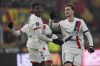 PSG's Fabian Ruiz, right, celebrates with his teammates after he scored his side's first goal during the French League One soccer match between Lens and Paris Saint-Germain, at the Bollaert-Delelis stadium in Lens, France, Saturday, Jan. 18, 2025. (AP Photo/Thibault Camus)