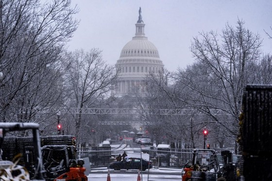 Snow falls on the Capitol in Washington, Sunday. (J. Scott Applewhite / The Associated Press)