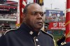 FILE - Sgt. 1st Class Alvy Powell sings the national anthem before a baseball game in Washington, July 4, 2013. (AP Photo/Alex Brandon, File)