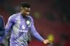 Manchester United's goalkeeper Andre Onana, right, leaves the pitch at the end of the English Premier League soccer match between Manchester United and Brighton and Hove Albion, at the Old Trafford stadium in Manchester, England, Sunday, Jan. 19, 2025. (AP Photo/Dave Thompson)