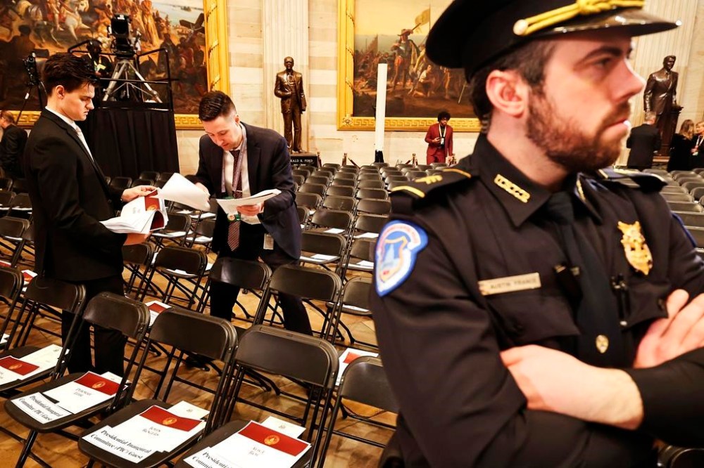 Staff prepare before the 60th Presidential Inauguration in the Rotunda of the U.S. Capitol in Washington, Monday, Jan. 20, 2025. (Chip Somodevilla/Pool Photo via AP)