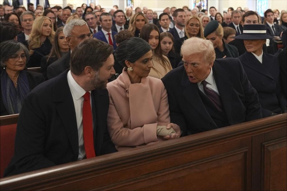 President-elect Donald Trump talks with Vice President-elect JD Vance and Usha Vance before a service at St. John's Church, Monday, Jan. 20, 2025, in Washington, ahead of the 60th Presidential Inauguration. (AP Photo/Evan Vucci)