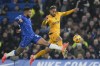 Chelsea's Reece James, left, duels for the ball with Wolverhampton Wanderers' Matheus Cunha during the English Premier League soccer match between Chelsea and Wolverhampton at Stamford Bridge stadium in London, Monday, Jan. 20, 2025. (AP Photo/Kin Cheung)