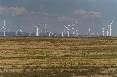 FILE - Wind turbines are seen from Interstate-84, Sunday, July 9, 2023, near Hammett, Idaho. (AP Photo/Lindsey Wasson, File)