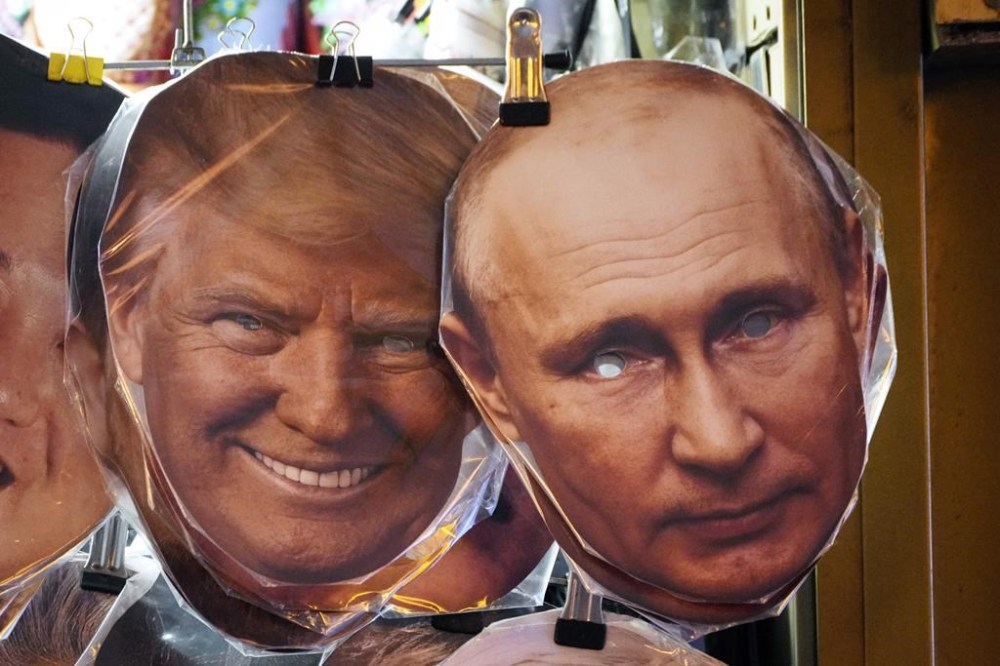 Face masks depicting US President-elect Donald Trump, left, and Russian President Vladimir Putin, right, hang among others for sale at a street souvenir shop in St. Petersburg, Russia, Monday, Jan. 20, 2025. (AP Photo/Dmitri Lovetsky)