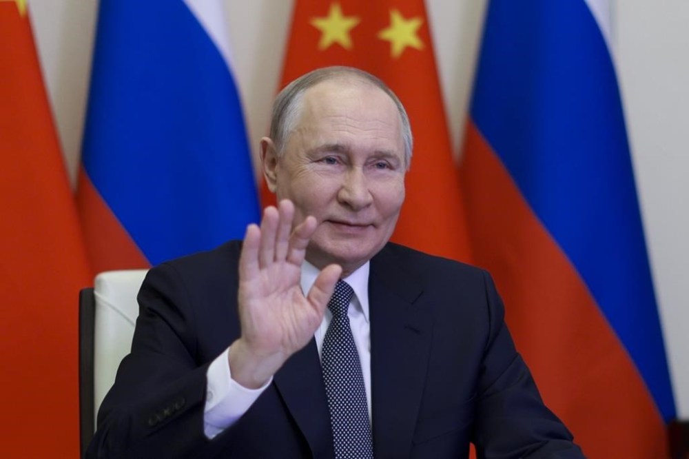 Russian President Vladimir Putin, gestures as he speaks with Chinese President Xi Jinping via videoconference at Novo-Ogaryovo state residence outside of Moscow, Russia, Tuesday, Jan. 21, 2025. (Gavriil Grigorov, Sputnik, Kremlin Pool Photo via AP)