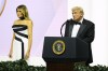 President Donald Trump speaks as first lady Melania Trump listens at the Commander in Chief Ball, Monday, Jan. 20, 2025, in Washington. (AP Photo/Alex Brandon)