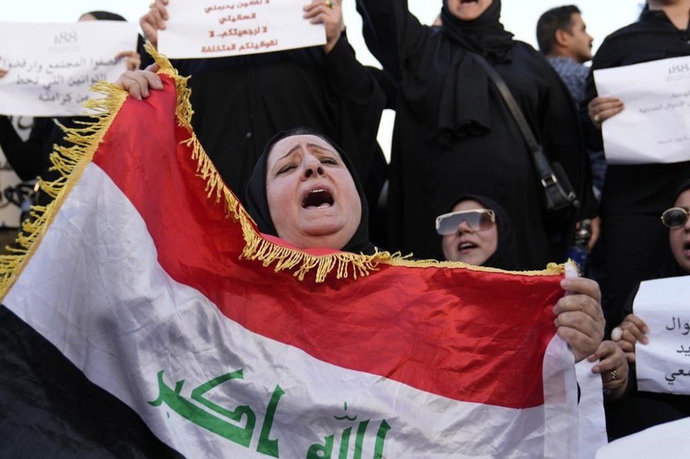 FILE - Protesters gather to demonstrate against a proposed law to permit underage female marriage in Tahrir Square in Baghdad, Iraq, Aug. 8, 2024. (AP Photo/Hadi Mizban, File)