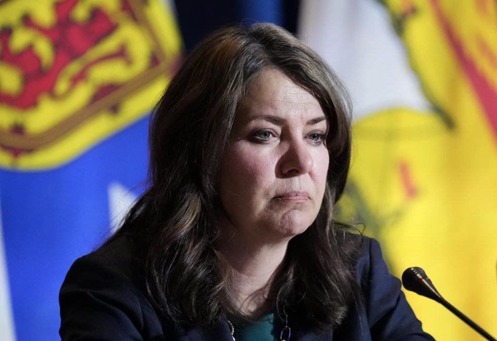 Alberta Premier Danielle Smith speaks to the media during the fall meetings of Canada's premiers in Toronto, Monday, Dec. 16, 2024. Smith is staying the course on her diplomatic approach to try to avert punishing tariffs from U.S. President Donald Trump as a new deadline looms. THE CANADIAN PRESS/Nathan Denette