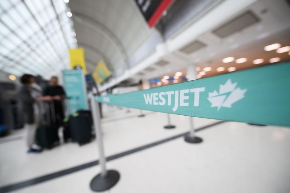 WestJet is gearing up for a major growth spurt this year, even as rival airlines limit their expansion plans. The WestJet check-in area at Pearson International Airport is photographed in Toronto, Saturday, June 29, 2024. THE CANADIAN PRESS/Christopher Katsarov”