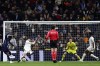 Celta's Jonathan Bamba, left, scores his side's first goal against Real Madrid during a Copa del Rey round of 16 soccer match at the Santiago Bernabeu stadium in Madrid, Spain, Thursday, Jan. 16, 2025. (AP Photo/Pablo Garcia)