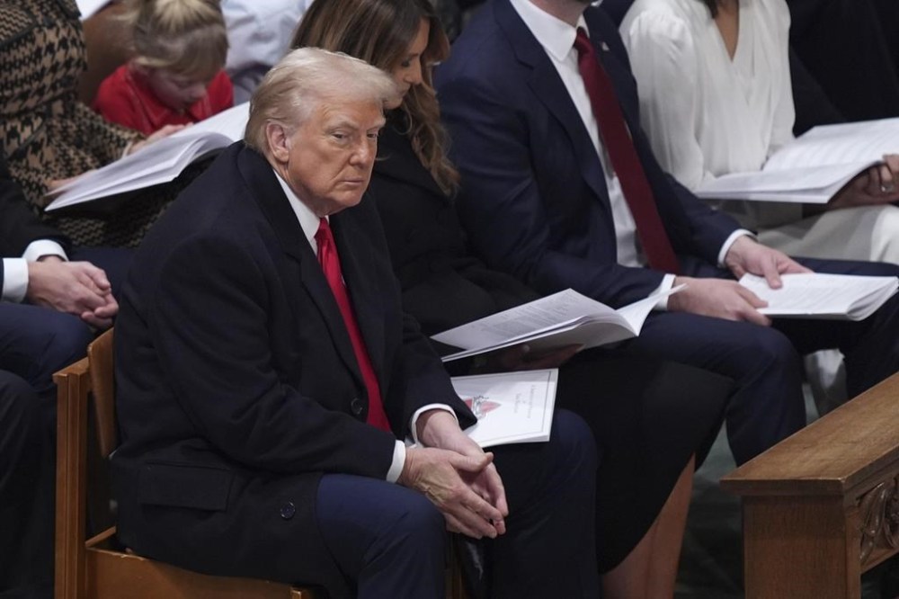 A CIBC report says sweeping tariffs imposed by the U.S. could cost the Canadian economy as much as 3.25 per cent, even factoring in possible exemptions to the oil and gas sector. President Donald Trump attends the national prayer service at the Washington National Cathedral, Tuesday, Jan. 21, 2025, in Washington. THE CANADIAN PRESS/AP/Evan Vucci