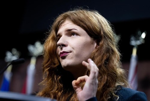 Fae Johnstone, executive director of the Society of Queer Momentum, speaks during a press conference on Parliament Hill in Ottawa on Wednesday, May 8, 2024. THE CANADIAN PRESS/Spencer Colby