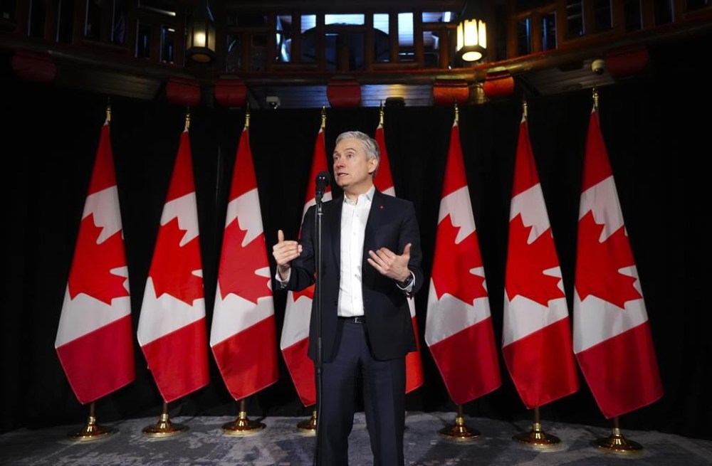 Innovation, Science and Industry Minister Francois-Philippe Champagne speaks to reporters during a cabinet retreat at Chateau Montebello in Montebello, Que., on Tuesday, Jan. 21, 2025. THE CANADIAN PRESS/Sean Kilpatrick