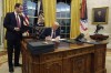 President Donald Trump signs an executive orders in the Oval Office of the White House, Monday, Jan. 20, 2025, in Washington. THE CANADIAN PRESS/AP-Evan Vucci