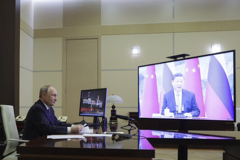 Russian President Vladimir Putin speaks with Chinese President Xi Jinping via videoconference at Novo-Ogaryovo state residence outside of Moscow, Russia, Tuesday, Jan. 21, 2025. (Gavriil Grigorov, Sputnik, Kremlin Pool Photo via AP)