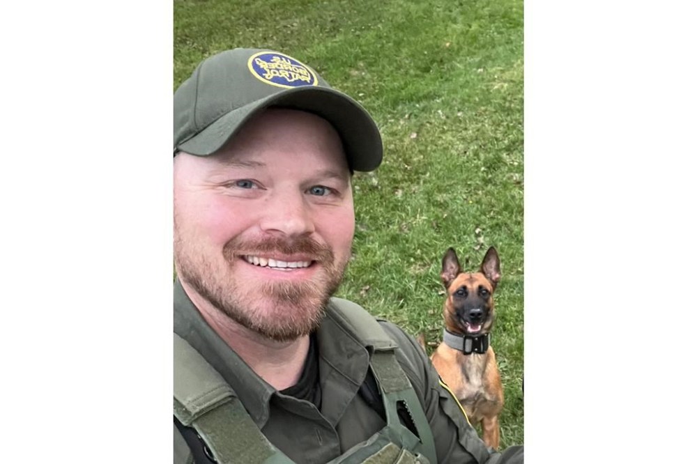 CORRECTS TO JOAN MALAND INSTEAD OF MUSSA - This undated image courtesy of Joan Maland shows U.S. Border Patrol agent David Maland and his K9 partner, Cora. David Maland was killed Monday, Jan. 20, 2025, following a traffic stop in Vermont. (David Maland/Joan Maland via AP)