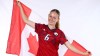 This undated photo shows April Lantaigne posing with a Canadian flag during a media session with the University of South Alabama. The 18-year-old midfielder from Whitby, Ont., has signed with AFC Toronto of the new Northern Super League. THE CANADIAN PRESS/HO-AFC Toronto **MANDATORY CREDIT**