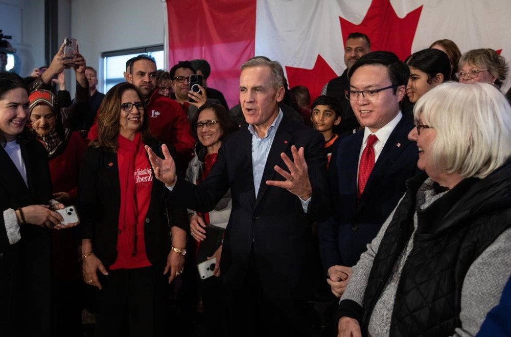Mark Carney talks with supporters during his Liberal leader campaign launch in Edmonton, on Thursday January 16, 2025.THE CANADIAN PRESS/Jason Franson