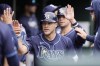 FILE - Tampa Bay Rays' Taylor Walls is greeted in the dugout after scoring in the third inning of a baseball game against the Detroit Tigers, Thursday, Sept. 26, 2024, in Detroit. (AP Photo/Carlos Osorio, File)