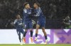 PSG's Bradley Barcola, right, celebrates with Desire Doue after scoring his side's second goal during a Champions League opening phase soccer match between Paris Saint-Germain and Manchester City at the Parc des Princes in Paris, Wednesday, Jan. 22, 2025. (AP Photo/Thibault Camus)