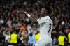 Real Madrid's Vinicius Junior celebrates after scoring his side's 5th goal during the Champions League opening phase soccer match between Real Madrid and FC Salzburg at the Santiago Bernabeu stadium in Madrid, Wednesday, Jan. 22, 2025. (AP Photo/Manu Fernandez)