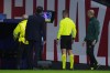 Referee Davide Massa, center, looks at the VAR before ruling a red card to Atletico Madrid's Pablo Barrios during a Champions League opening phase soccer match against Bayer 04 Leverkusen at the Riyadh Air Metropolitano stadium in Madrid, Spain, Tuesday, Jan. 21, 2025. (AP Photo/Manu Fernandez)