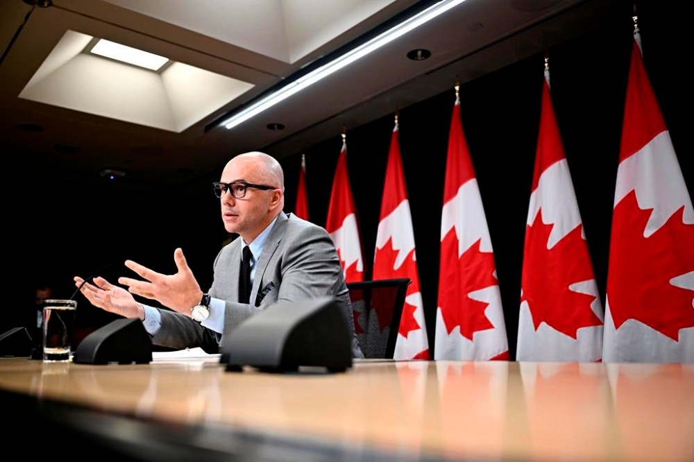 Alex Benay, Associate Deputy Minister at Public Services and Procurement Canada, speaks during a news conference at the National Press Theatre in Ottawa, on Tuesday, July 9, 2024. The federal government is expanding its use of artificial intelligence to clear a backlog of Phoenix pay system transactions as it transitions to a new platform. THE CANADIAN PRESS/Justin Tang