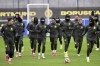 Dortmund players run during a training one day ahead of their Champions League soccer match against FC Bologna, in Dortmund, Germany, Monday Jan. 20, 2025. (Federico Gambarini/dpa/dpa via AP)