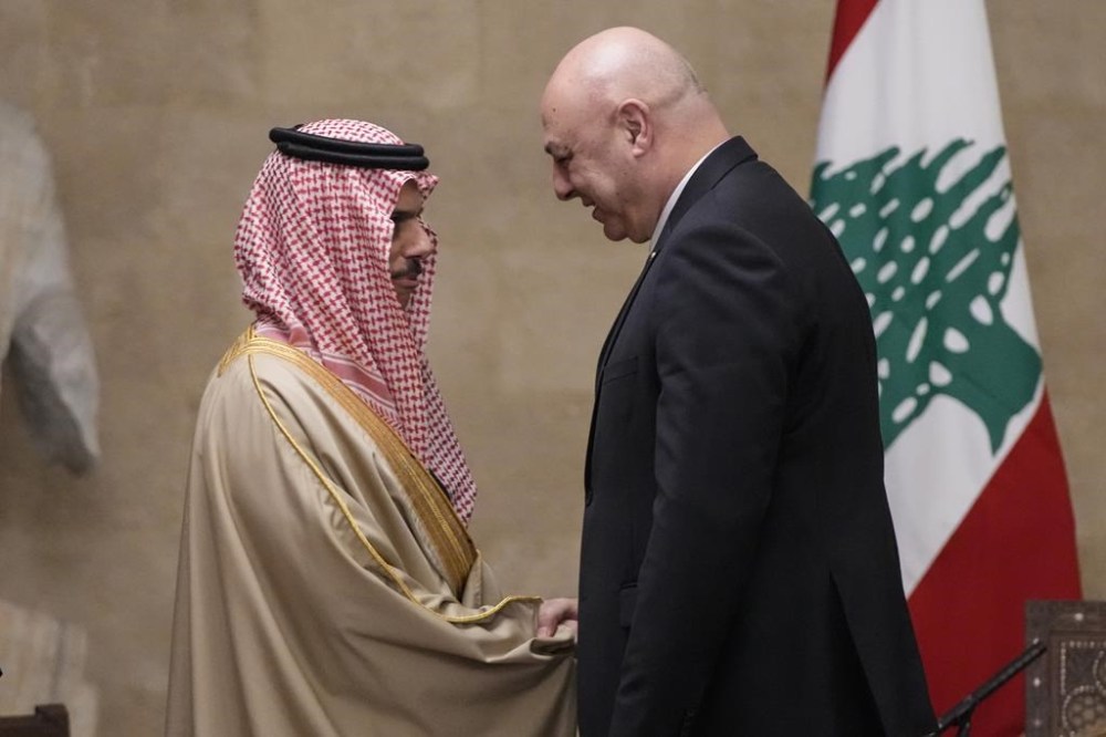 Lebanese President Joseph Aoun, right, shakes hands with Saudi Arabia's Foreign Minister Prince Faisal bin Farhan al-Saud at the presidential palace in Baabda, east of Beirut, Lebanon, Thursday, Jan. 23, 2025. (AP Photo/Hassan Ammar)