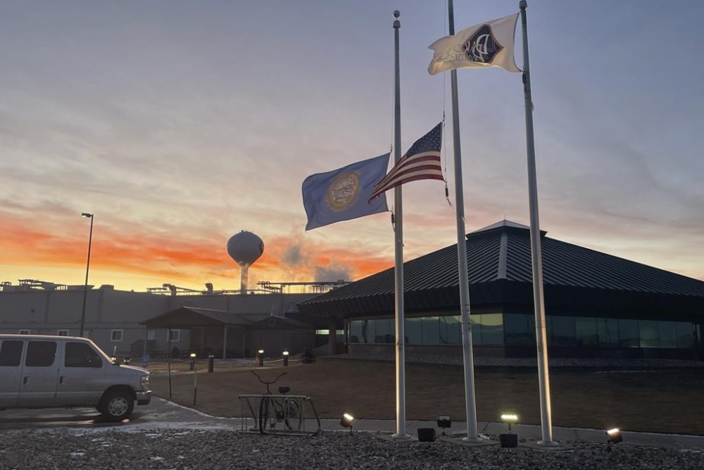 The Dakota Provisions turkey plant near Huron, S.D., at sunset Jan. 15, 2025. A co-op of ethnic German Hutterite farmers, who arrived in the 19th century, own the plant. But migrants from Venezuela, Thailand and other countries who have laid roots in South Dakota perform the dangerous work for low pay. (AP Photo/Joshua Goodman)